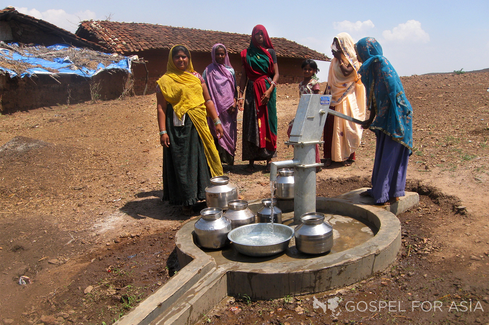 Women draw pure, clean drinking water from a Jesus Well - KP Yohannan - Gospel for Asia